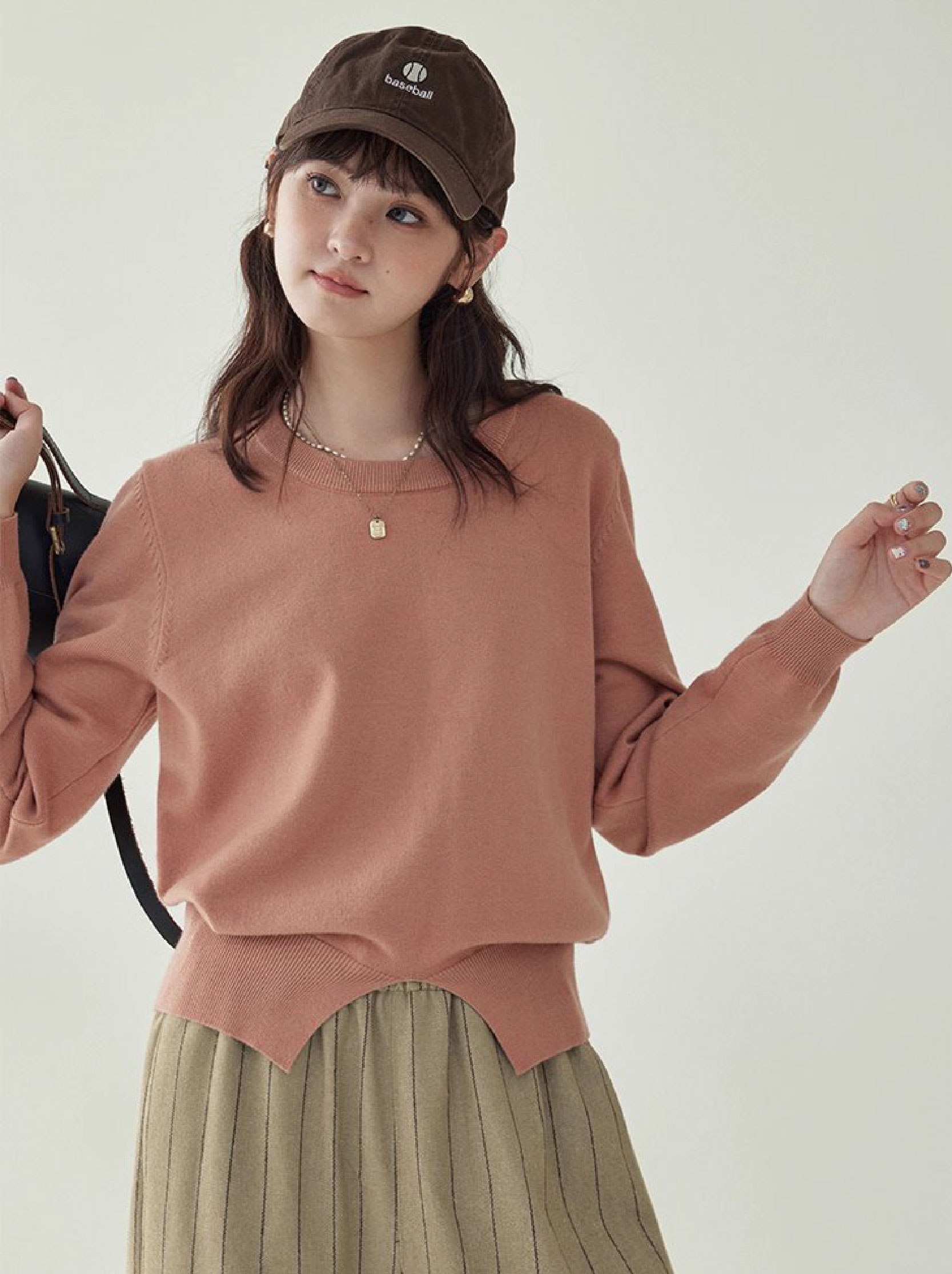 簡約純色下擺開叉針織衫女秋季新款圓領長袖上衣