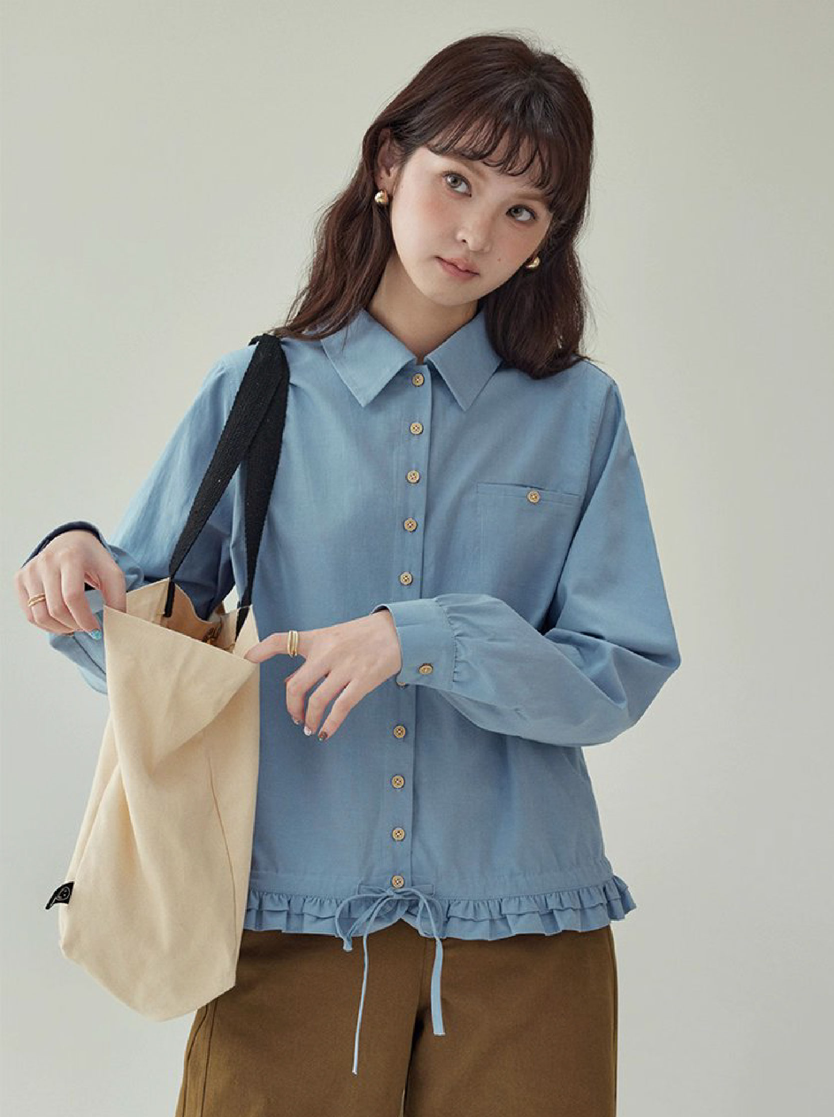 藍色花邊下擺抽繩襯衫女秋季新款單排扣長袖上衣