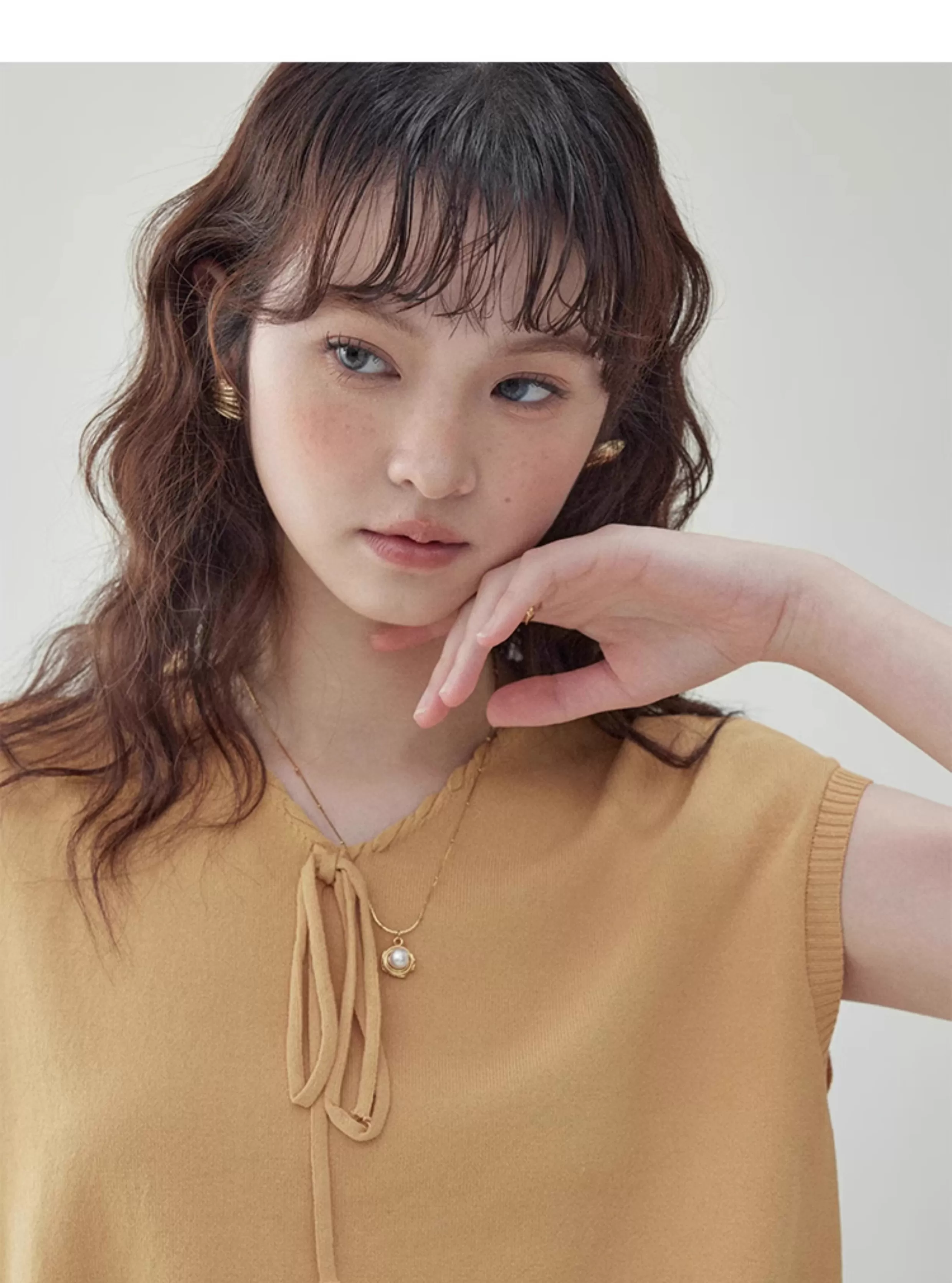 黃色綁帶v領無袖針織衫女夏季新款寬鬆短上衣