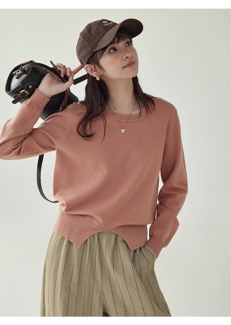 簡約純色下擺開叉針織衫女秋季新款圓領長袖上衣