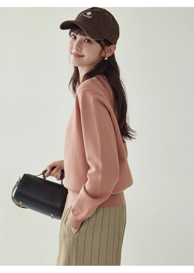 簡約純色下擺開叉針織衫女秋季新款圓領長袖上衣