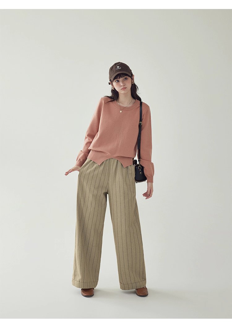 簡約純色下擺開叉針織衫女秋季新款圓領長袖上衣