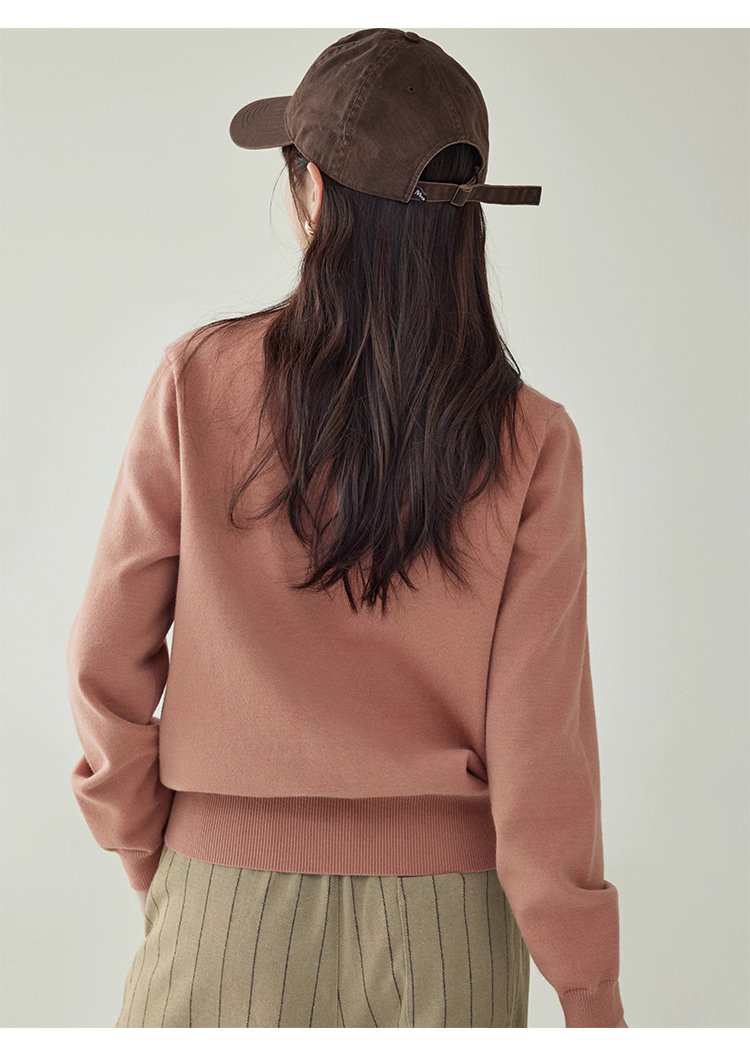 簡約純色下擺開叉針織衫女秋季新款圓領長袖上衣