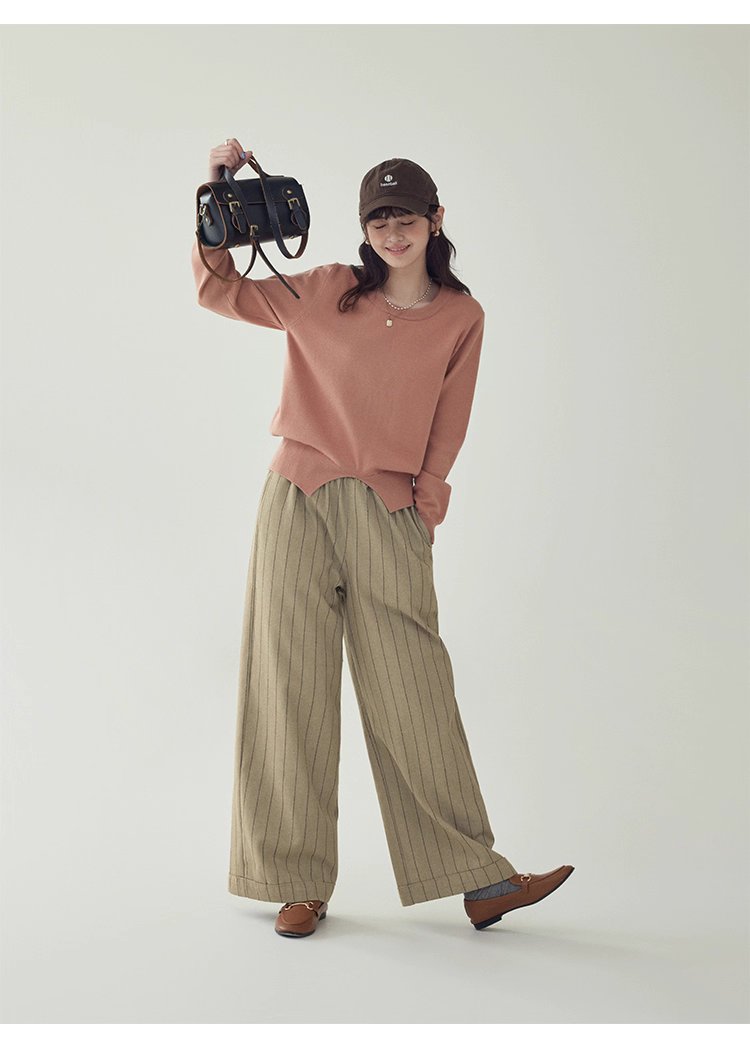 簡約純色下擺開叉針織衫女秋季新款圓領長袖上衣