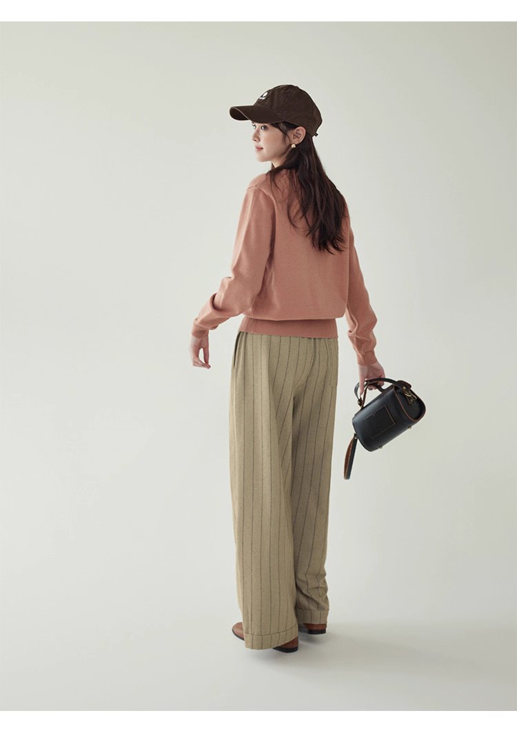 簡約純色下擺開叉針織衫女秋季新款圓領長袖上衣