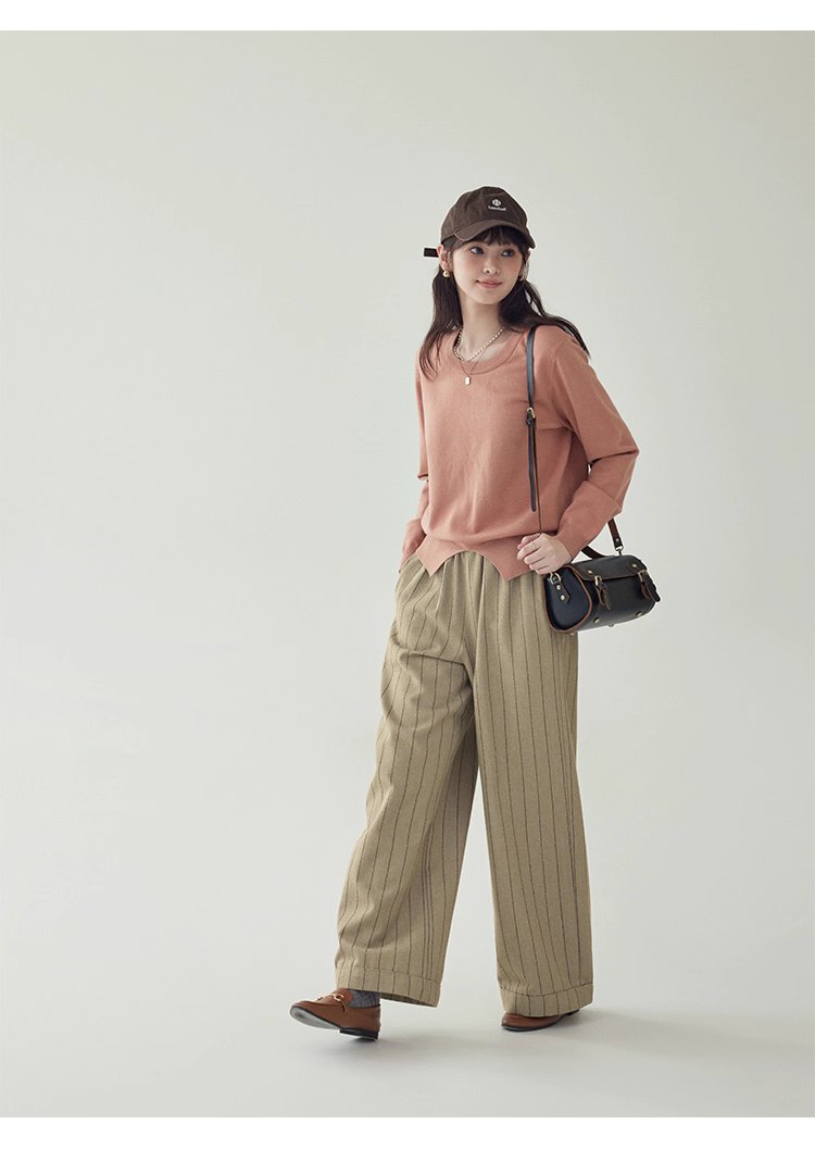 簡約純色下擺開叉針織衫女秋季新款圓領長袖上衣